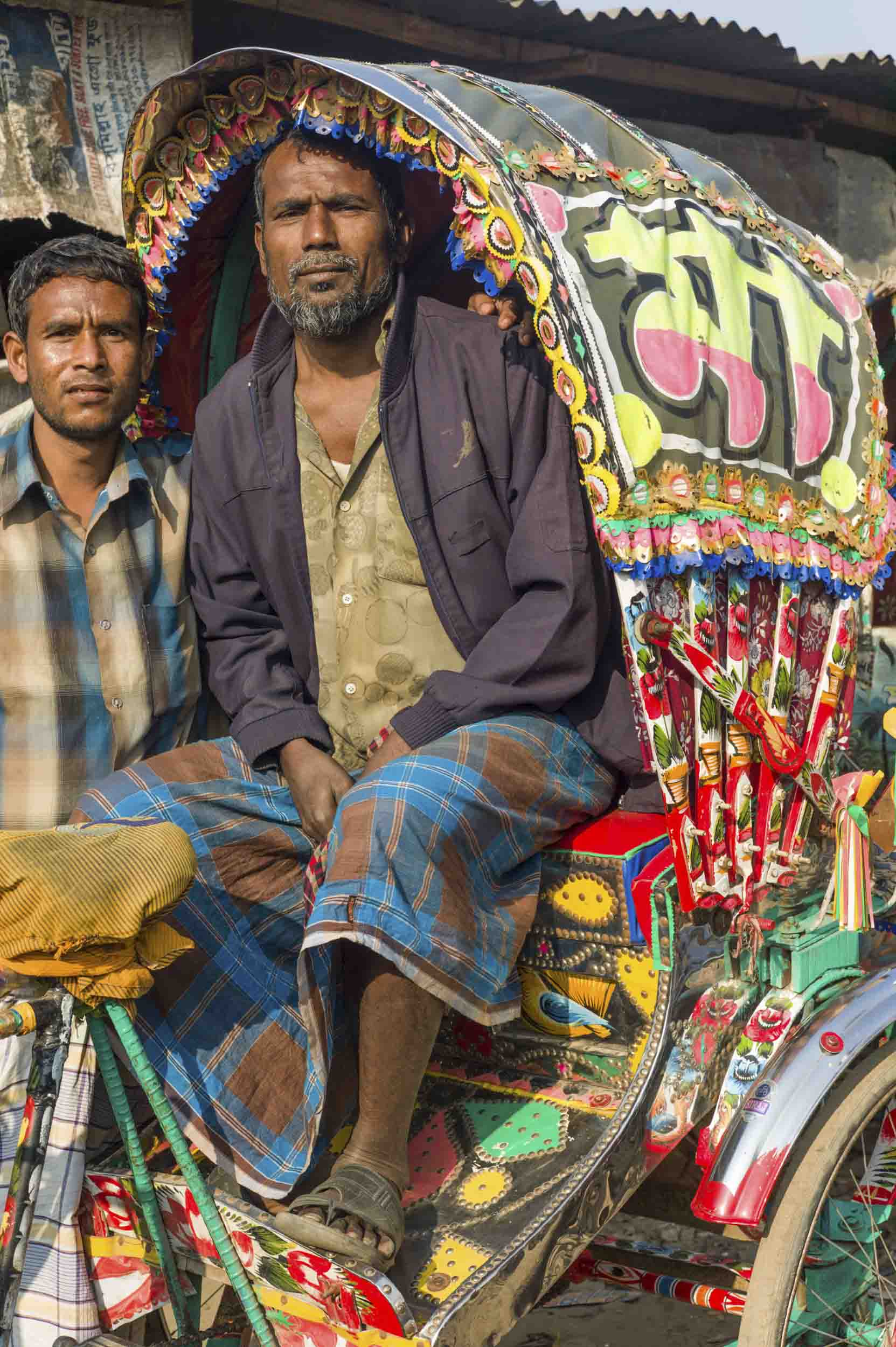 A rickshaw driver at his livery in a Dhaka slum, 2012
