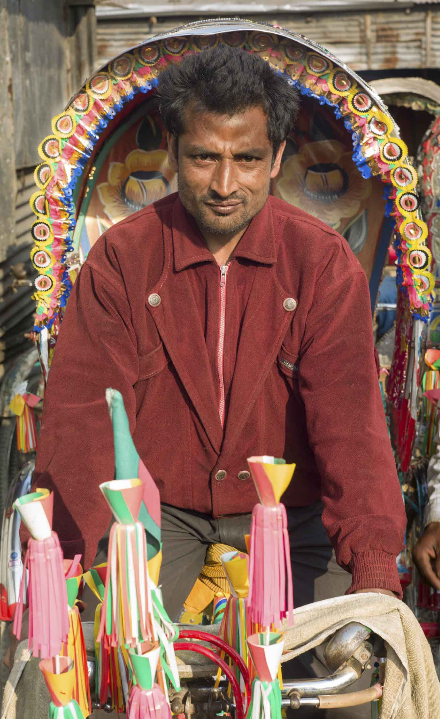 A rickshaw driver at his livery in a Dhaka slum, 2012