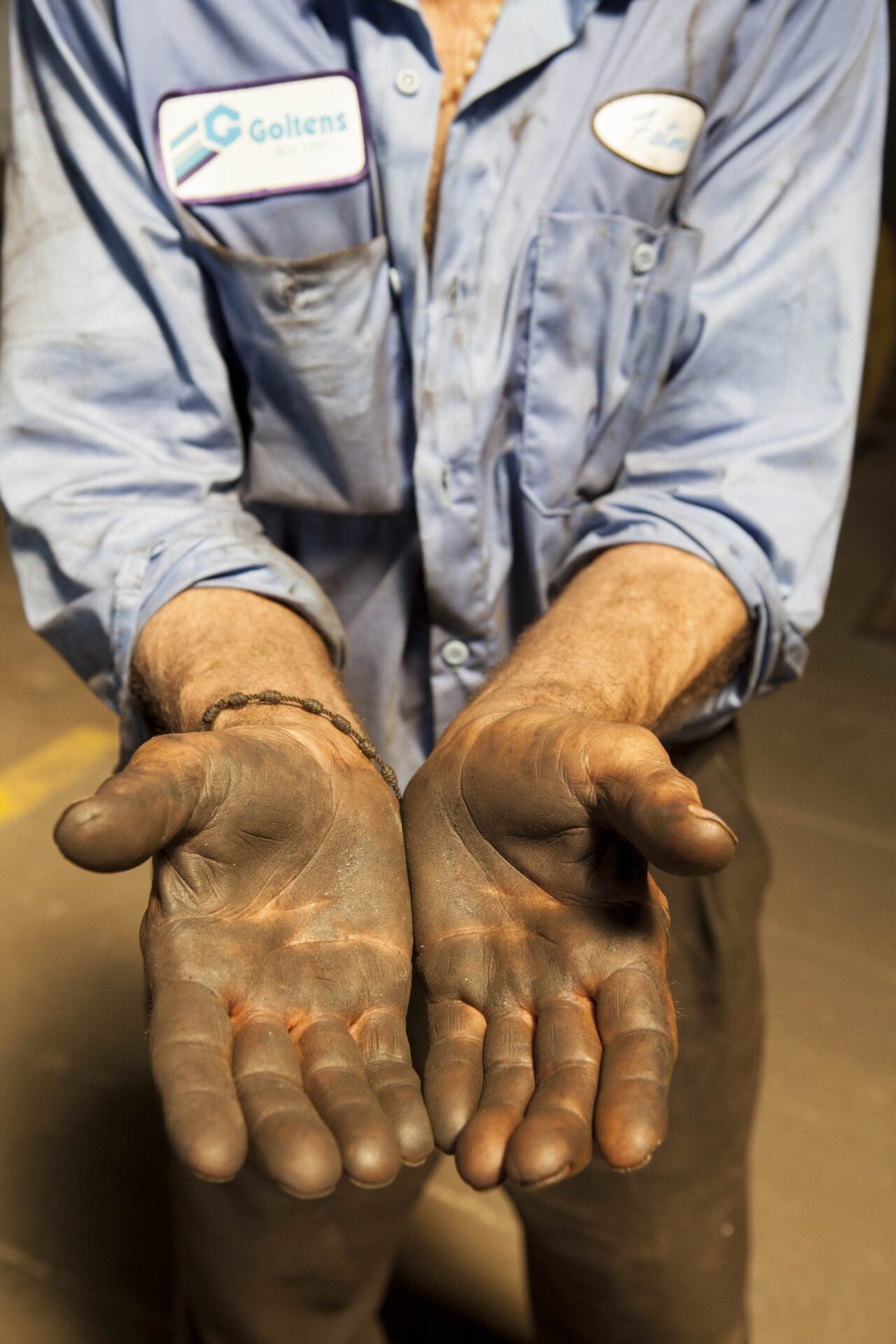Dominic Rama's grease-stained hands