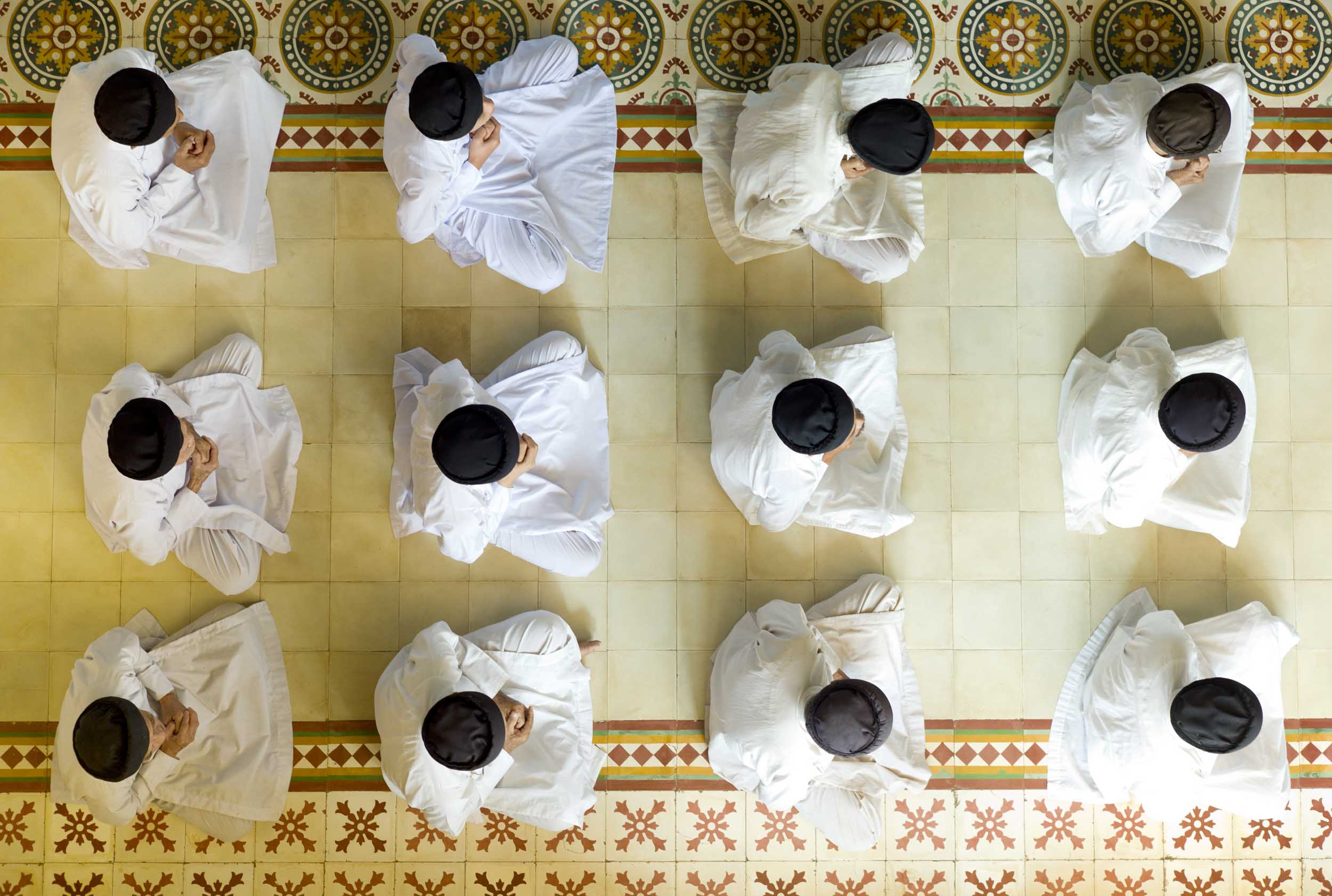 Worshipers at the Cao Dai Great Holy See Temple, a faith that blends Buddhism, Christianity, and Confucianism, 2011