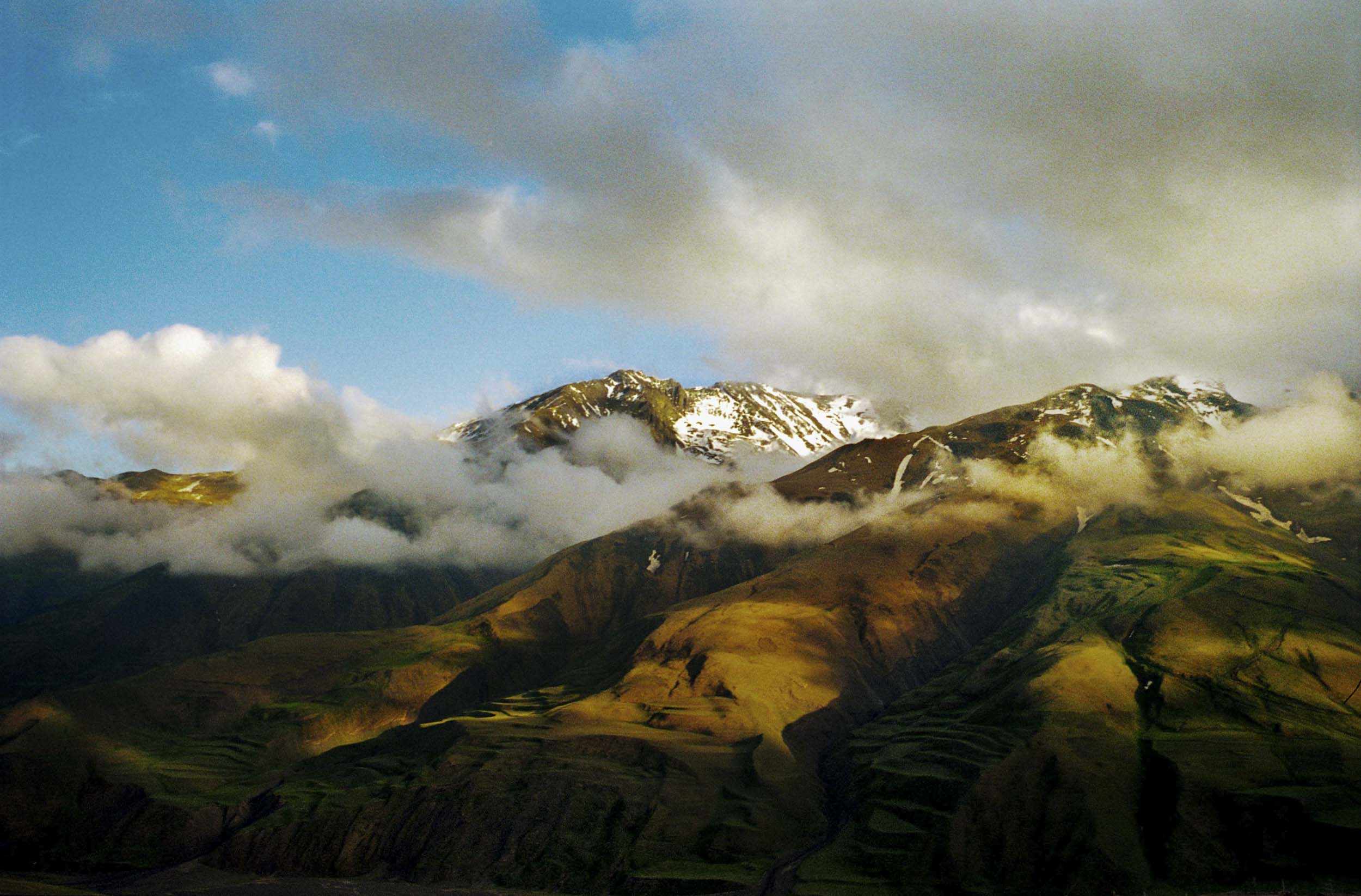 Deep in the Caucuses Mountains where modern civilization ends, beauty begins. The view from Xinaliq, a rugged mountain town where residents live in stone structures carved into the mountainside, 2005