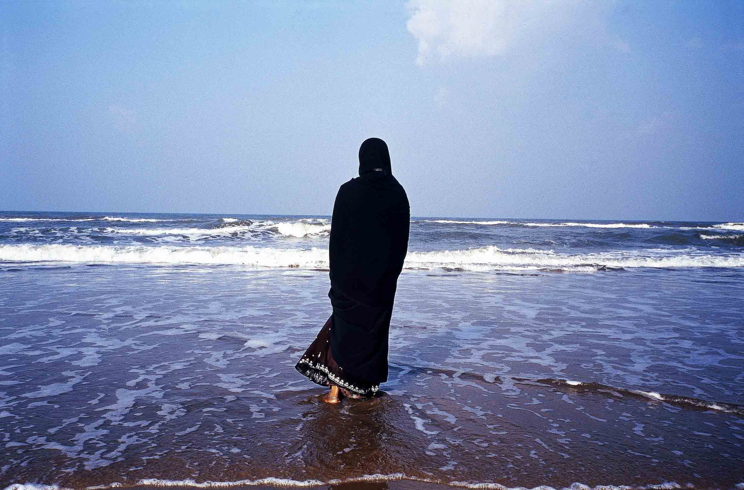 A Muslim woman watches the ocean in Tamil Nadu. Nagapattinam, India, 2005