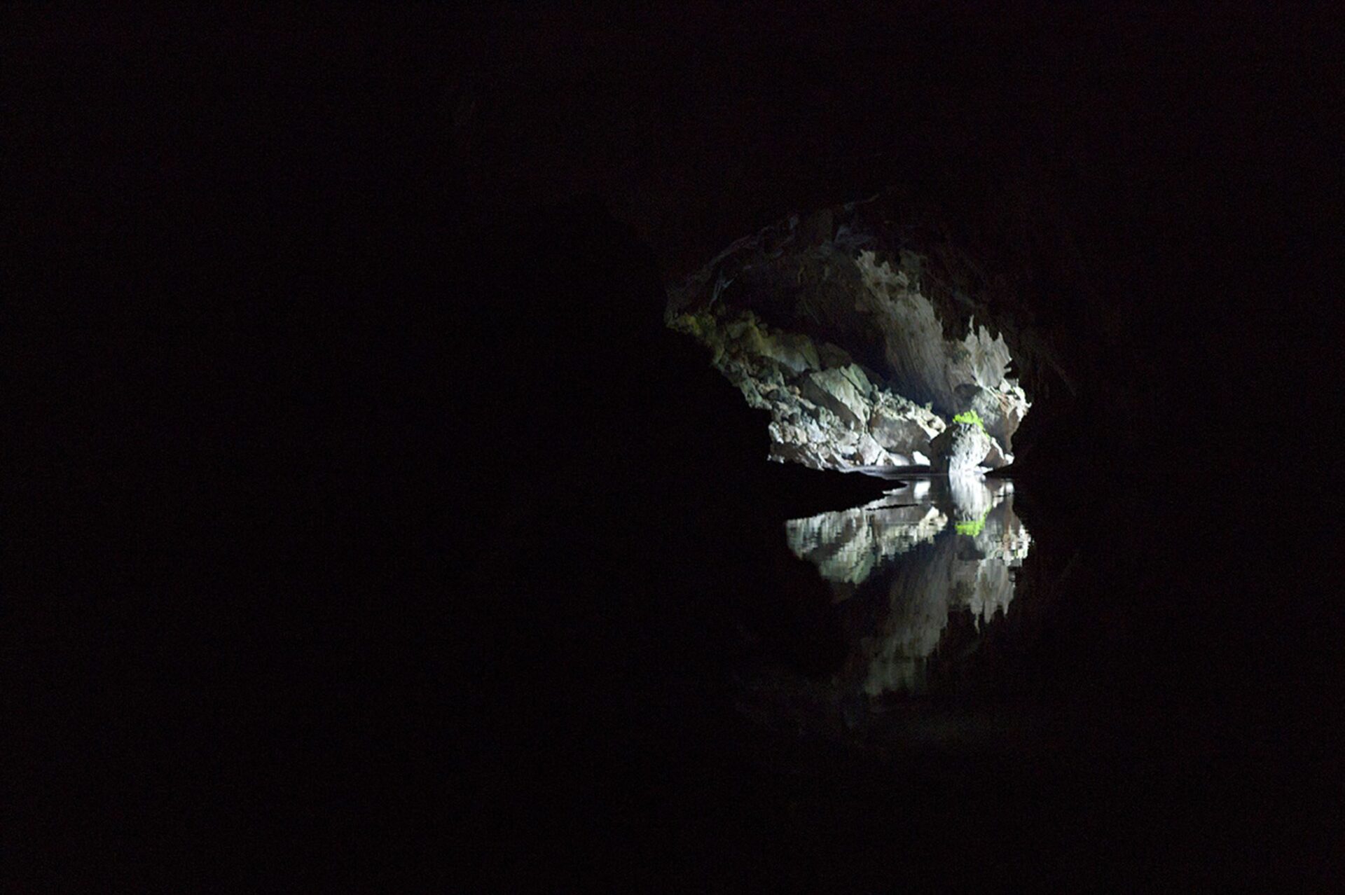 The Nam Hin Bun River cuts through the Kong Lor Cave, a limestone karst. The seven-and-a half-kilometer long cave is more than 100-meters tall in places and full of stalactites, 2011