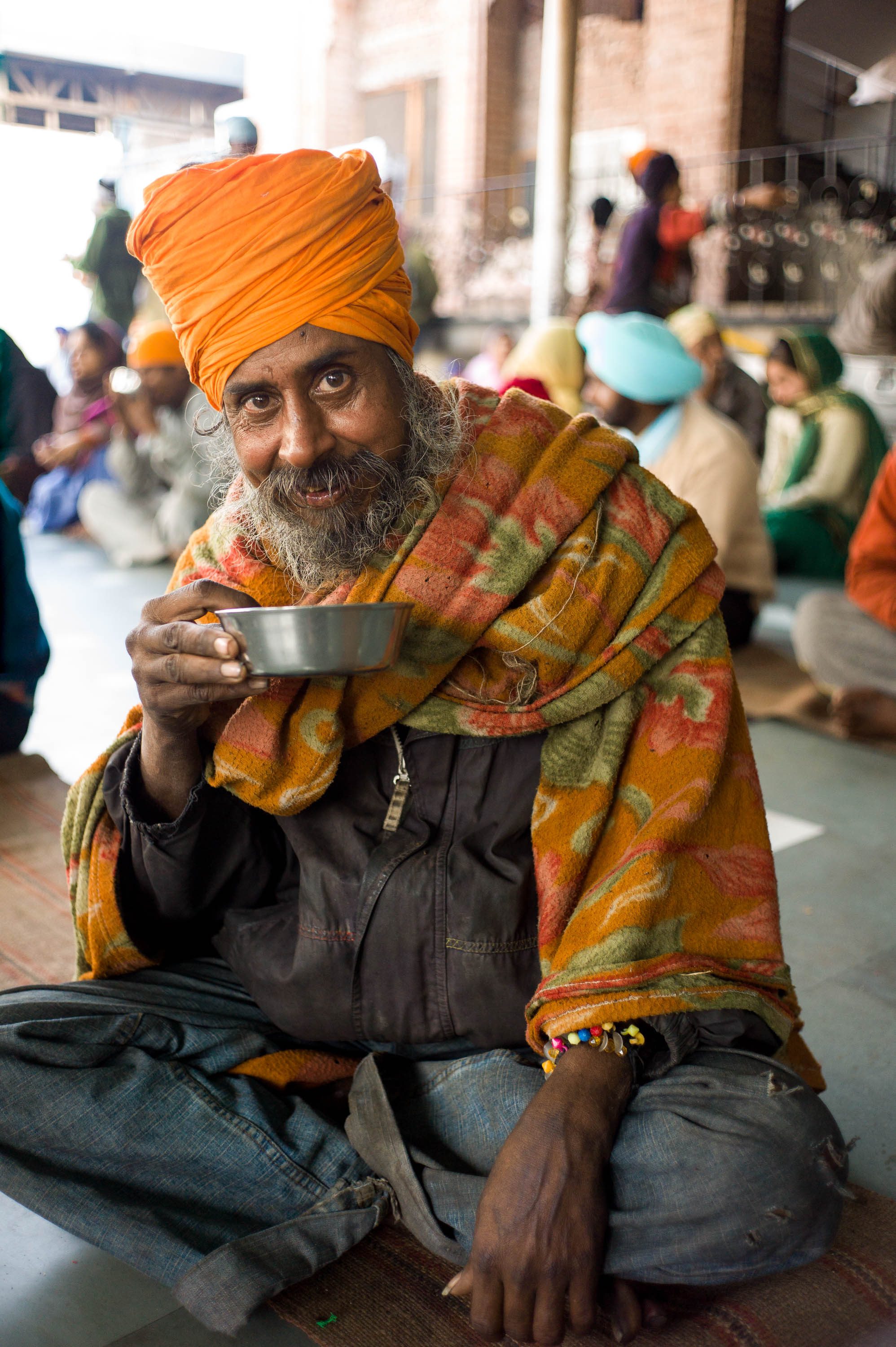 A visitor eating breakfast in the Golden Temple’s volunteer-staffed communal kitchen. More than 50,000 free meals are served daily. Amritsar, India, 2012
