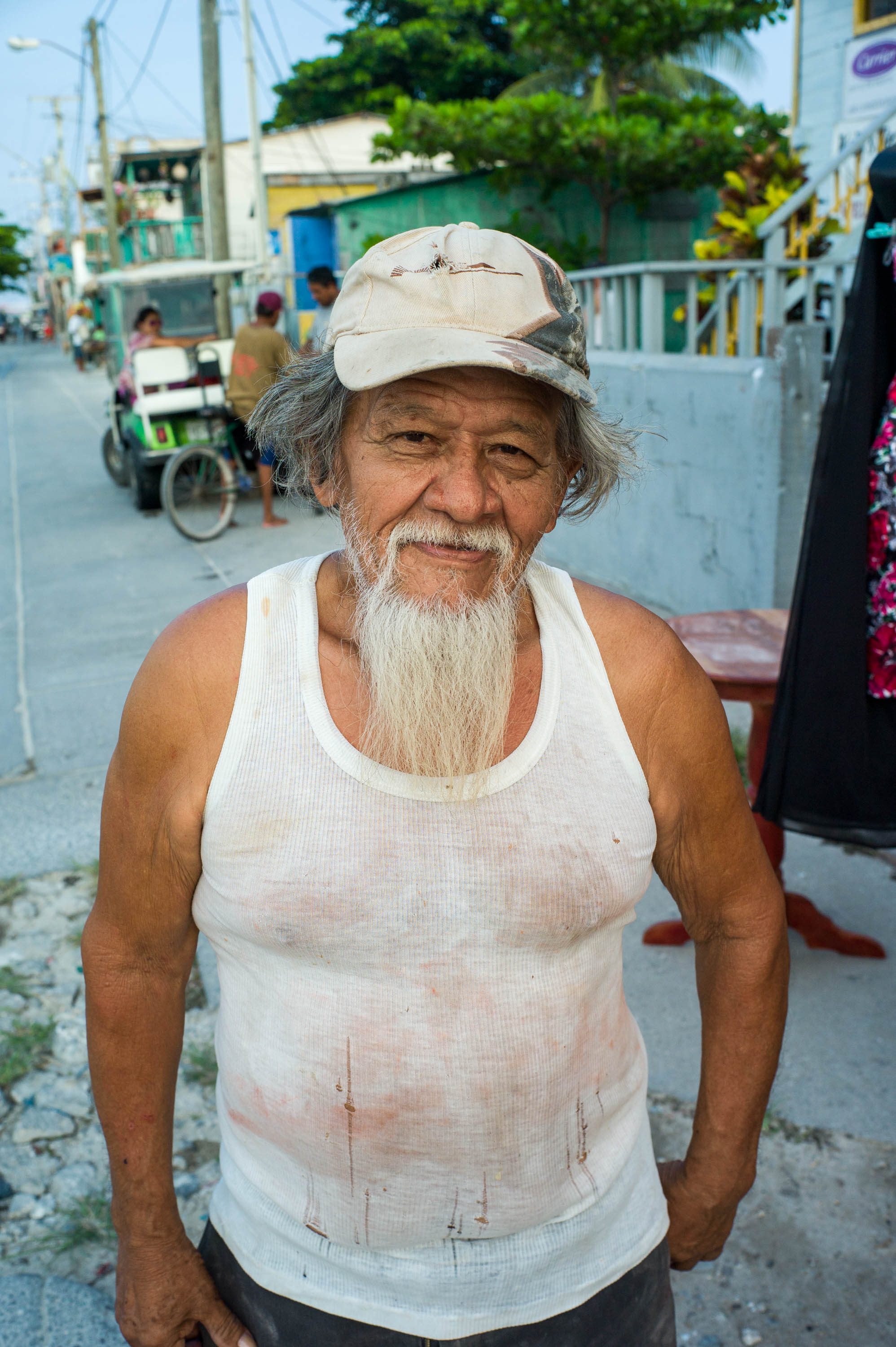 Carlos Vincente Gonzalez, age 73, a carpenter and craftsman who carves masks. Ambergris Caye, Belize, 2016