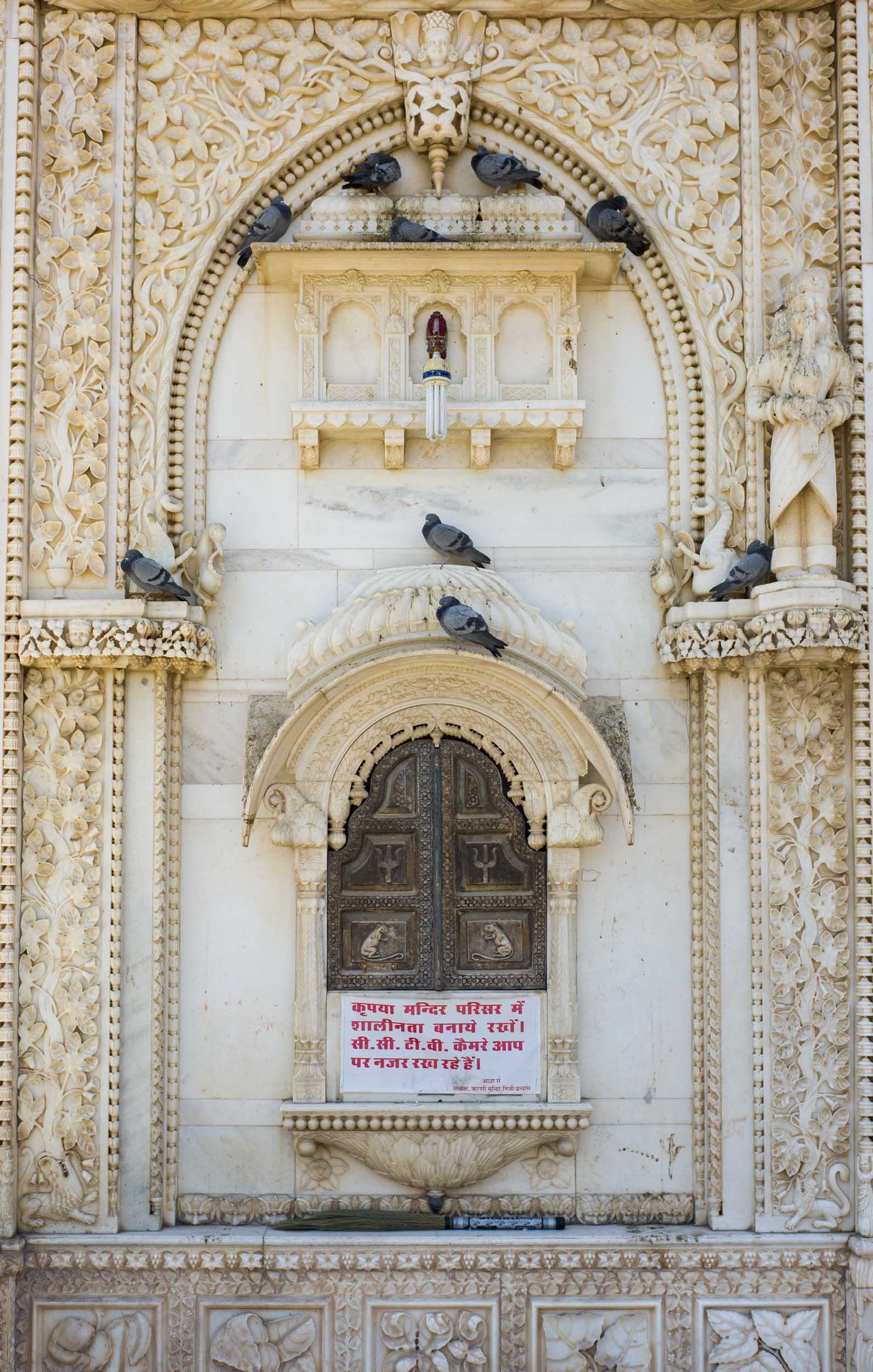 The 7th image caption should be: Built in the early 20th century, the Karni Mata Temple’s ornately carved marble façade, 2012