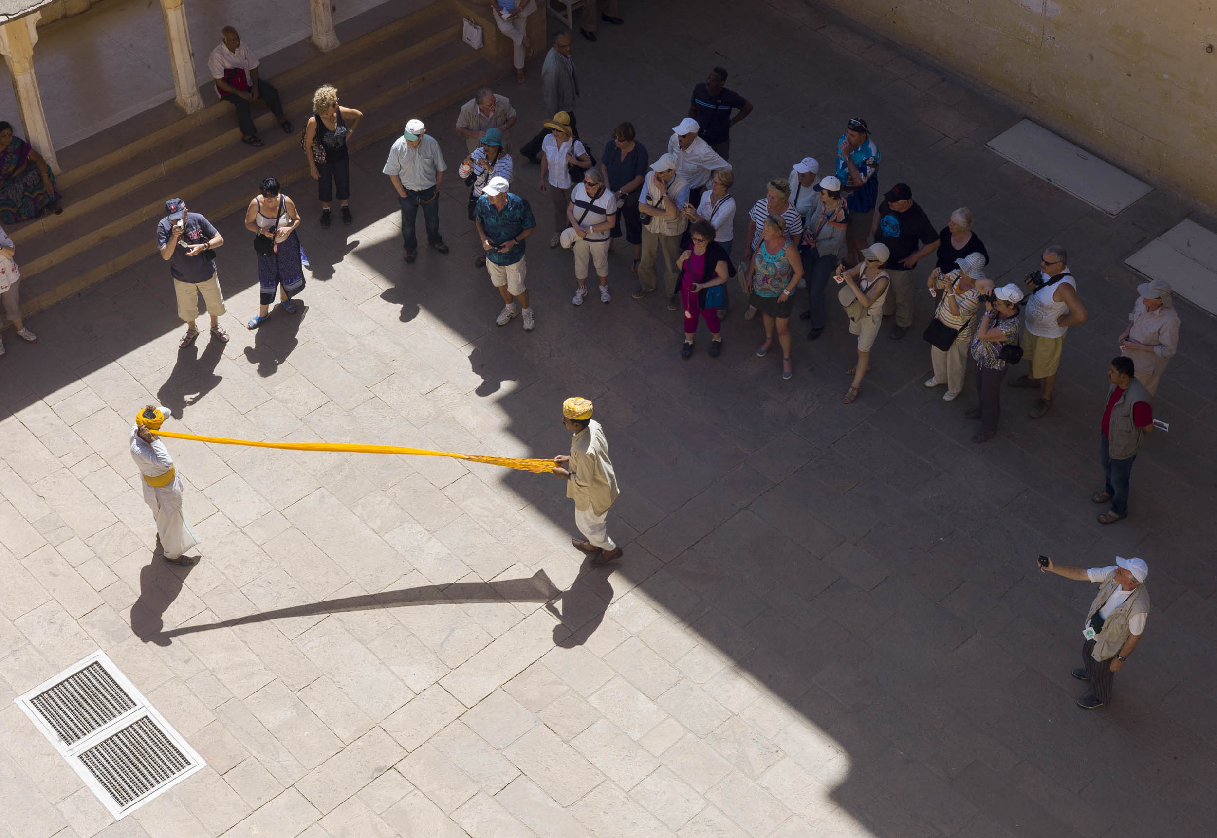 Guards wrapping turbans while tourists watch in Jodhpur’s Mehrangarh Fort, 2012