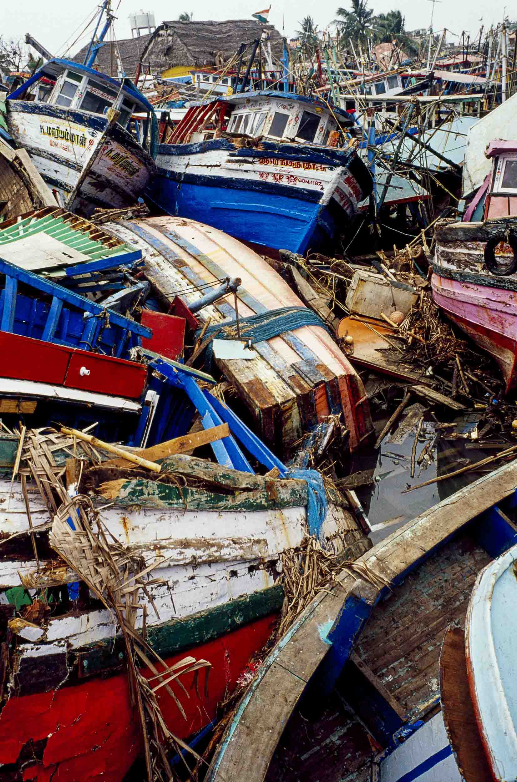 A shattered pile of fishing boats in the Nagapattinam port. Nagapattinam, India, 2005