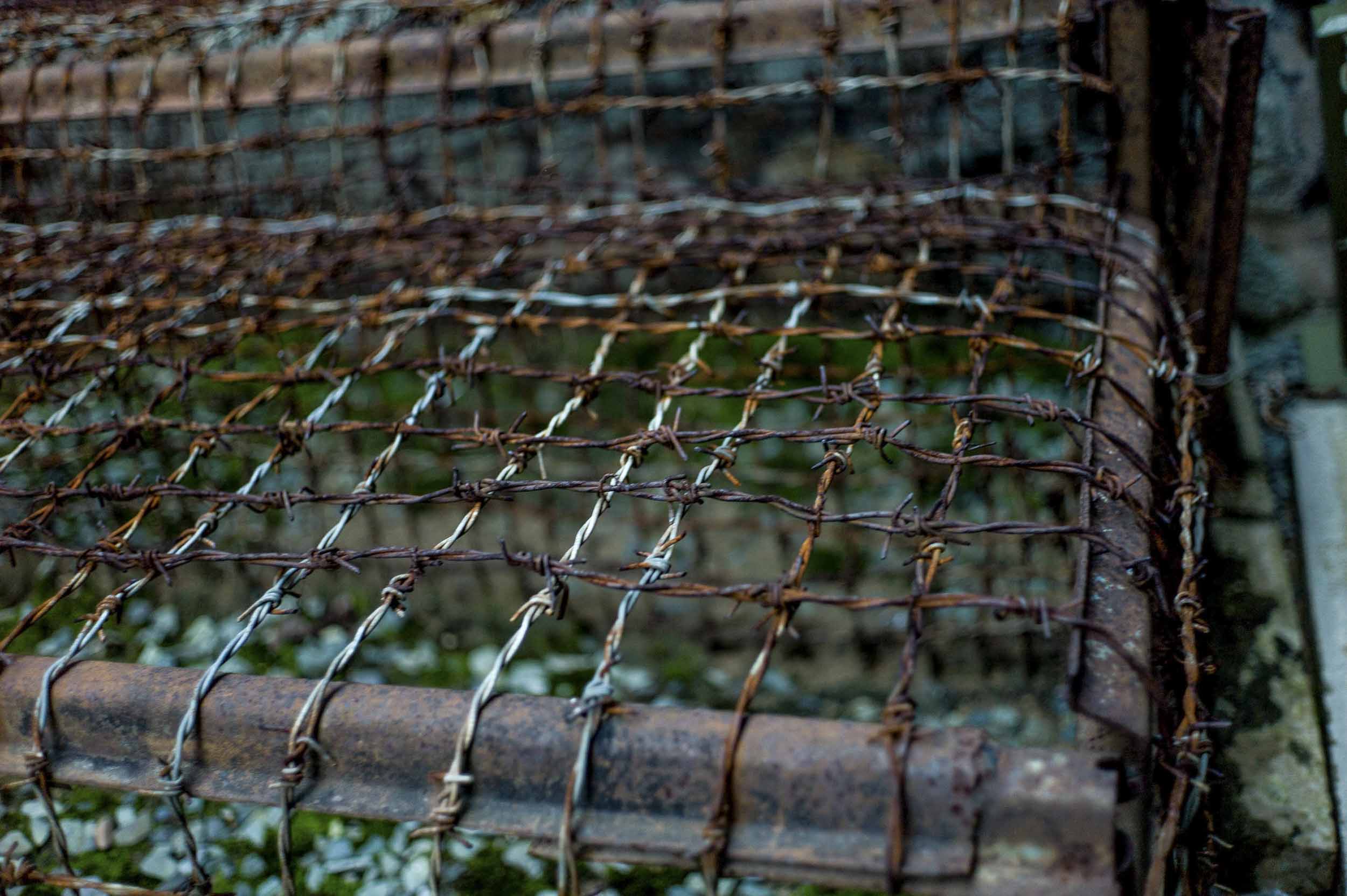 A barbed wire “tiger cage” used to hold multiple prisoners, on display at Ho Chi Minh City’s War Remnants Museum, 2011